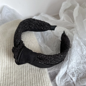 Elegant black tweed headband with silver shimmer and knot detail for women