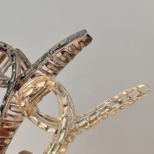 Elegant amber resin hair claw clip with crystals and sparkling rhinestone details