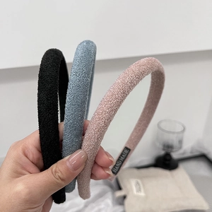 Three-piece set of minimalist fabric headbands in black, pink and blue sponge material