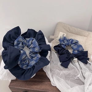 Denim floral scrunchies set with daisy embroidery and metallic heart pendant details