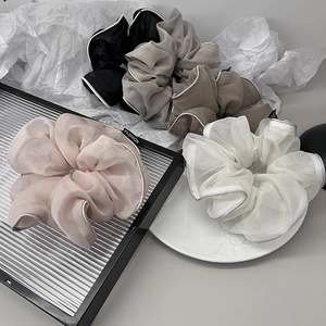 Elegant organza scrunchies set with silver edges in neutral tones for women's hair styling