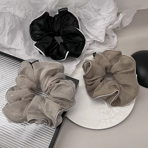 Set of three organza scrunchies in black, grey, and brown with elegant silver edges