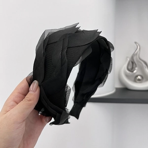 Elegant wide black mesh headband with layered lace ruffles and voluminous pleated texture