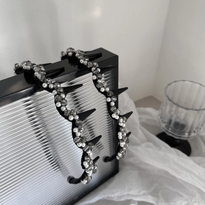 Elegant beaded headband set with pearls and crystals on metallic silver display box