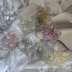 Frangipani flower hair claw clip with colorful ink splatter design in various shades