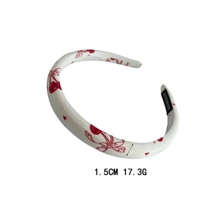 Cute white cloth headband with red cherry patterns and handmade label detail