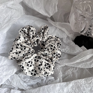 Elegant satin scrunchie with black clover floral print on white vintage fabric