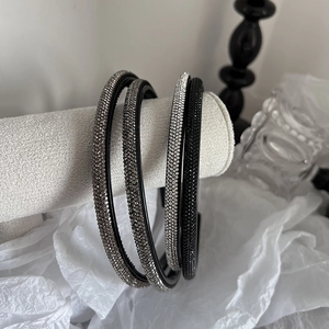 Set of four minimalist thin rhinestone headbands in black, silver, and grey tones