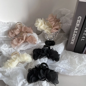 Elegant large floral hair claws in black, beige, and pink colors for women