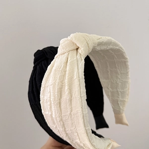 Classic black and white twisted knot sponge headbands with textured bubble fabric