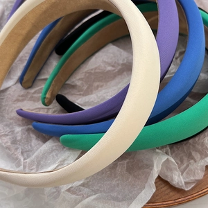 Close-up of assorted colorful padded sponge headbands in various trendy pastel colors
