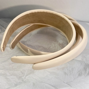 Three pieces of cream beige padded faux leather headbands with soft brown velvet lining
