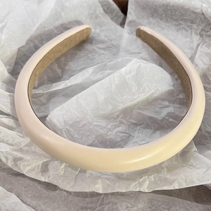 Detail of high-crown pink leather headband with soft non-slip velvet inner lining
