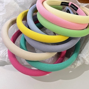 Serre-têtes rembourrés colorés aux tons macaron avec finition en tissu texturé