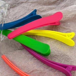Colorful matte alligator hair clips in vibrant candy colors for professional styling