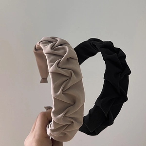Chic pleated fabric headband set in black and beige colors for elegant hair styling