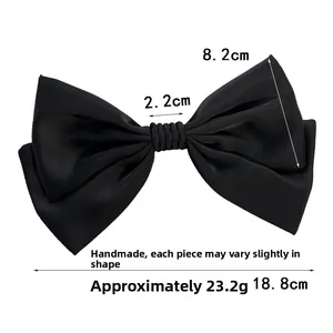 Detailed view of black satin bow hair clip with dimensions showing 18.8cm width
