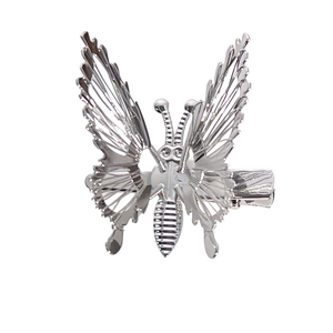 Polished silver butterfly hair clip with layered hollow wings and metal duckbill clip