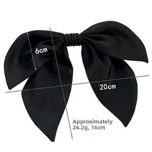 Detailed view of a black satin bow hair clip with measurements 20cm width and 24.2g weight