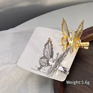 Vintage hollow butterfly hair clips in gold and silver finish with detailed wing texture