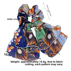 Close-up of floral chiffon scrunchie showing detailed measurements of bow and fabric