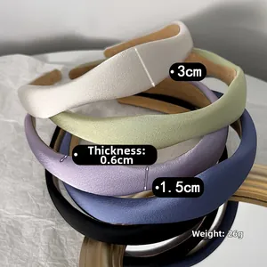 Detail view of padded satin headband showing dimensions 3cm width and 0.6cm thickness