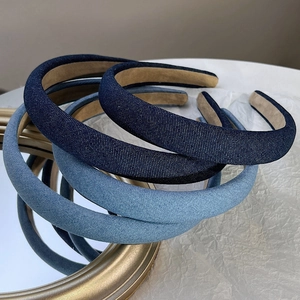 Detail of padded denim headbands with soft non-slip velvet lining in blue shades