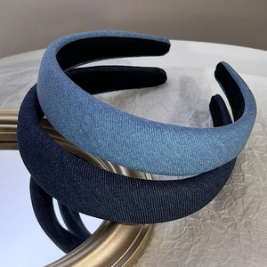 Padded denim headbands in light and dark blue sets on a mirror background