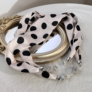 Polka dot silk hair ribbon scarf with magnetic rhinestone buckle on vintage tray