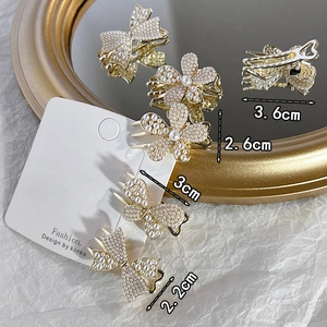 Elegant gold alloy hair clips with white pearls in butterfly and flower designs