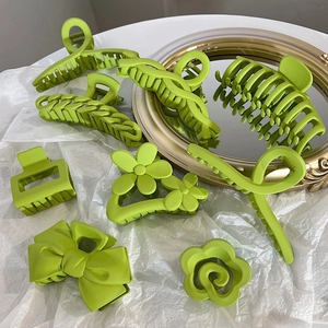 Matte lime green hair claw set with flower, bow and geometric shapes for women