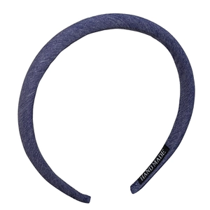 Classic dark blue denim headband with handmade label on minimalist thin sponge base