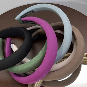Thick sponge headband collection in multiple colors featuring handmade woven label