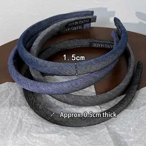 Set of four vintage denim fabric headbands in dark blue, mid blue, grey and black colors