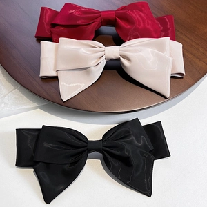 Elegant large satin bow hair clip in burgundy, cream, and black French style ribbon