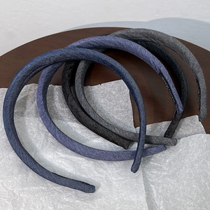 Retro denim blue padded headbands in various shades on minimalist background