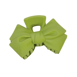 Minimalist green bow hair claw clip for elegant summer hairstyles on white background