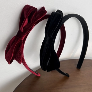 Elegant velvet bow headbands in deep red and black with a vintage layered design