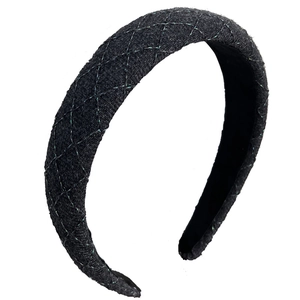 Serre-tête en tweed noir avec carreaux métalliques verts pour un effet volume élevé