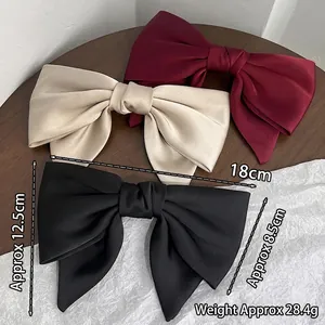 French style oversized satin bow hair clip in burgundy, champagne, and black colors