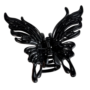 Elegant black butterfly hair claw clip with glossy finish and liquid metal texture