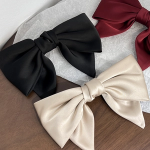 Elegant large satin bow hair clips in black, burgundy and champagne colors for women