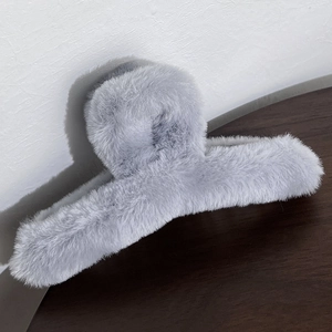 Detailed view of large grey plush hair claw clip with soft faux fur for thick hair