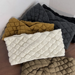 Knitted wide twist headband with diamond pattern in multiple warm winter colors