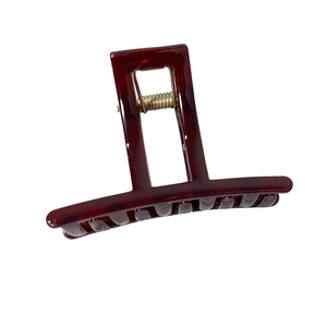Elegant wine red square hollow hair claw clip with glossy jelly finish and gold spring