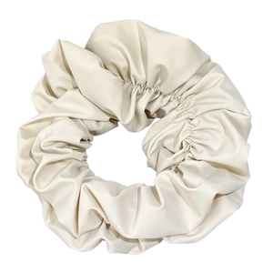 Elegant beige oversized scrunchie hair tie with high-quality matte pleated fabric