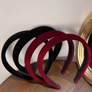 Detail of red and black velvet padded headbands with vintage thick sponge design