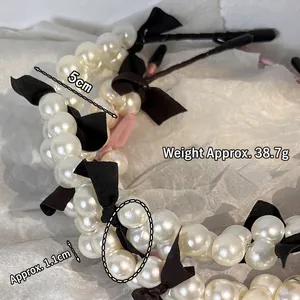 Elegant French pearl headband with a black fabric bow, 5cm width and 38.7g weight