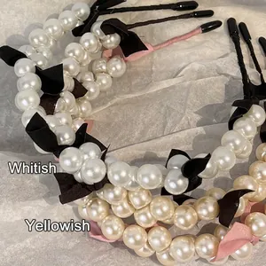 French style pearl headbands with black bows in cool white and warm white finishes