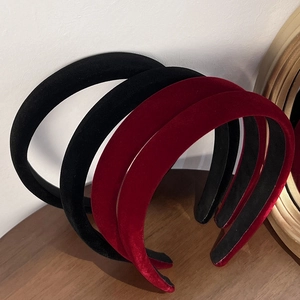 French vintage thick velvet headbands in black and wine red colors on a wooden surface